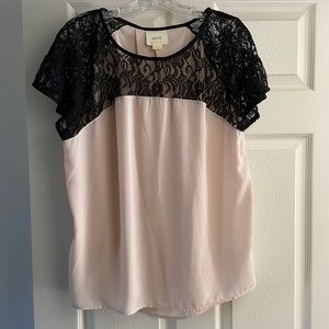 Anthropologie black lace and cream silky top.